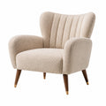 Poltrona in tessuto bouclé con gambe in legno colore beige